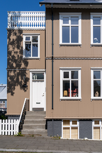 Reykjavik, Iceland - July 10, 2023: Interesting brown and white home or guesthouse with traditional scandinavian architecture