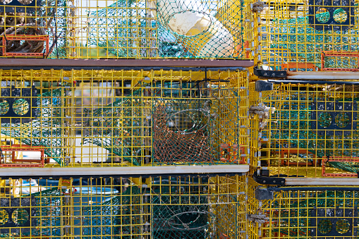 Stacks of  new lobster pots waiting to be loaded on fishing boat
