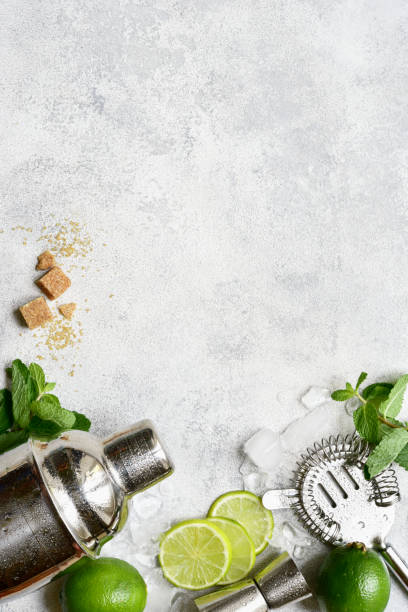 istock Ingredients for making mojito - delicious lime cocktail with mint. Top view with copy space. 1802581188