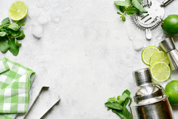 istock Ingredients for making mojito - delicious lime cocktail with mint. Top view with copy space. 1802583327