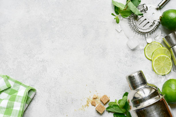 istock Ingredients for making mojito - delicious lime cocktail with mint. Top view with copy space. 1802583328