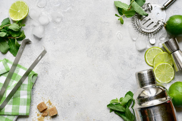 istock Ingredients for making mojito - delicious lime cocktail with mint. Top view with copy space. 1802587091