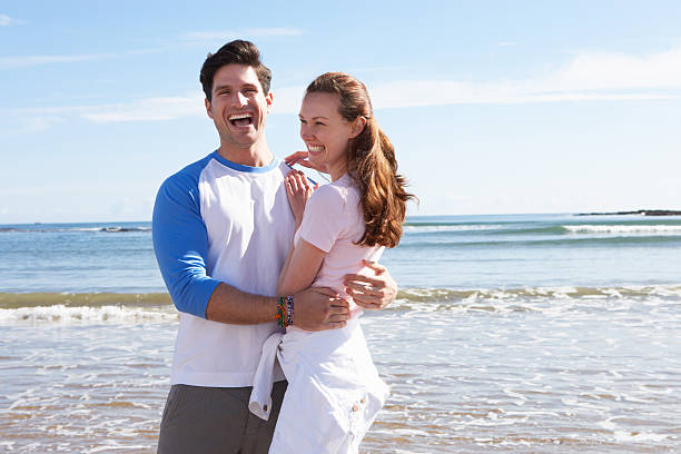 istock Couple Having Fun On Beach Holiday 180262226