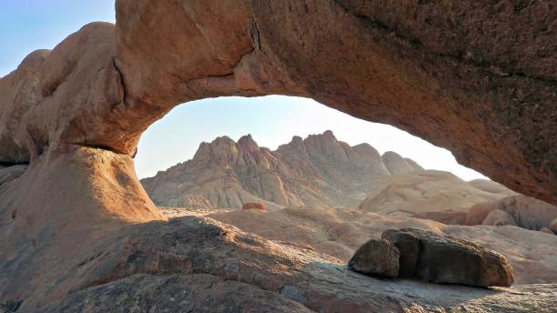 istock View through the Natural Arch with Spitzkoppe Massif in a distance 1802662425