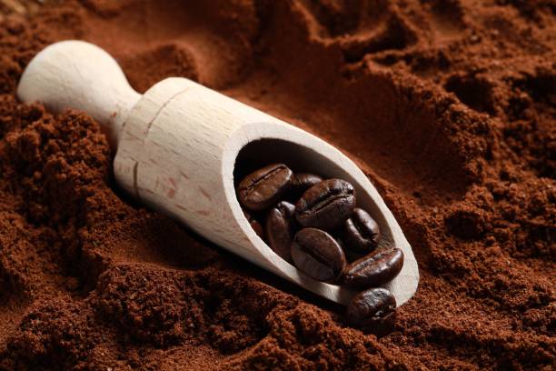 istock Scoop with roasted beans on ground coffee, closeup 1802670916