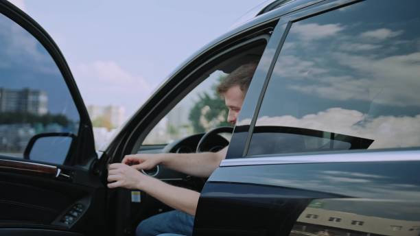 istock Young man helping little boy getting out the car. Slow motion 1802680118