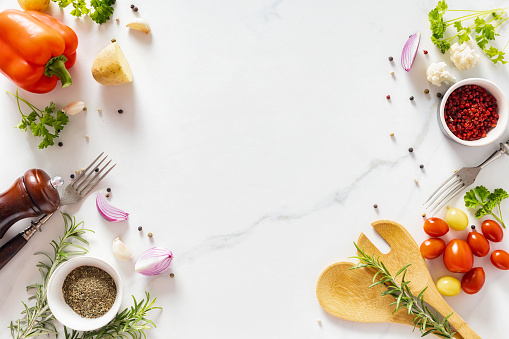 Menu background. Wooden spoon with spices and ingredients for cooking food on white background with copy space top view