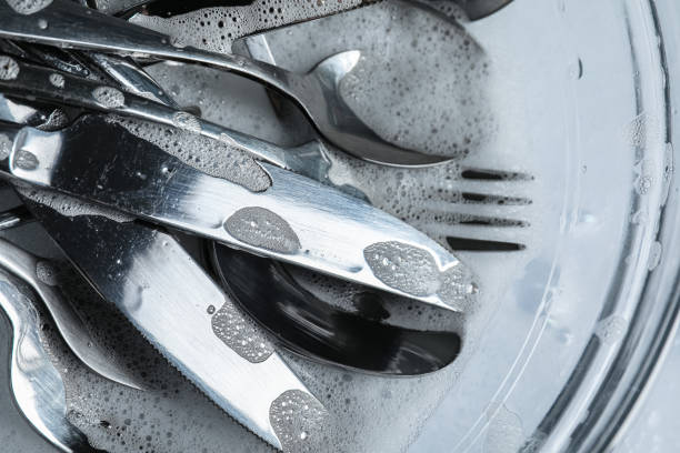 istock Glass bowl with silverware in foam, top view 1802709647
