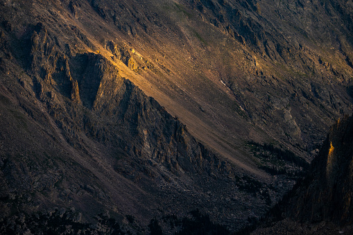 Golden Light Blankets Cliffs In Rocky Mountain