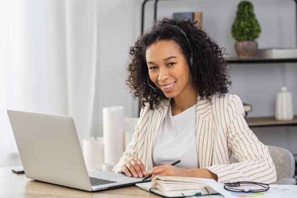 istock Woman with headset and laptop, call center or customer support worker 1802721528