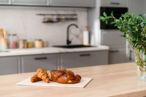 istock Selective focus on fresh baked pastry on wooden kitchen island 1802760469