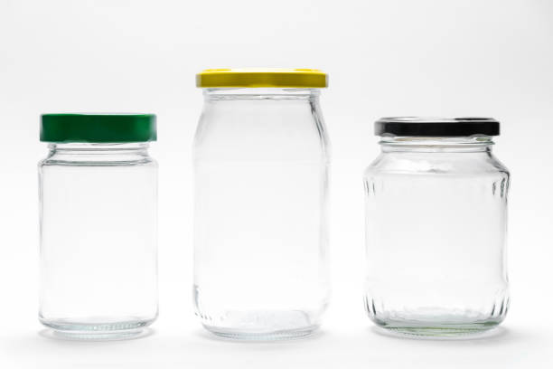 istock Empty transparent glass jars with lids isolated on white background 1802761524