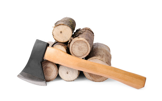 Metal ax and wood logs on white background