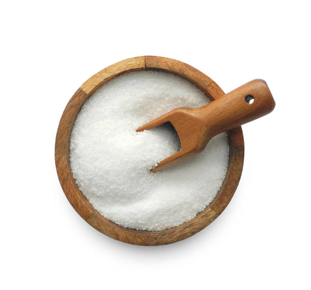 istock Salt in wooden bowl isolated on white 1802785411
