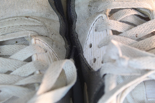 Old vintage damaged futsal sports shoes  on white background  isolated