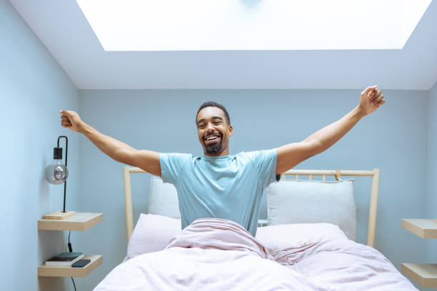 istock Cheerful African American man waking up 1802789200