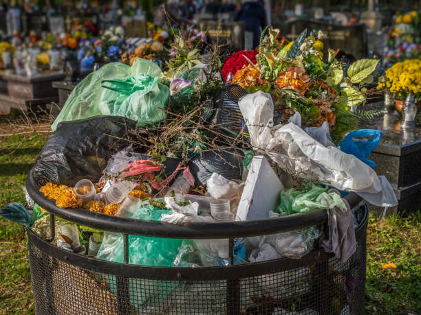 istock Cemetary trash bin full of tombstone waste decorations 1802795033