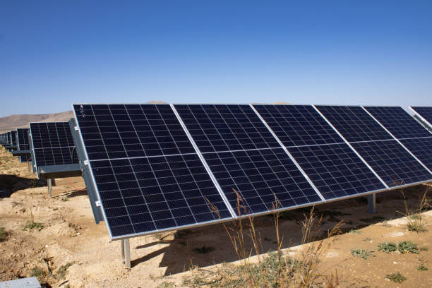 istock Solar panels under the blue sky in the wasteland 1802796645