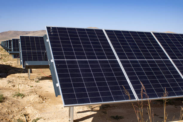 istock Solar panels under the blue sky in the wasteland 1802798193