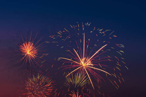 istock Colorful fireworks on night sky background. 1802810905