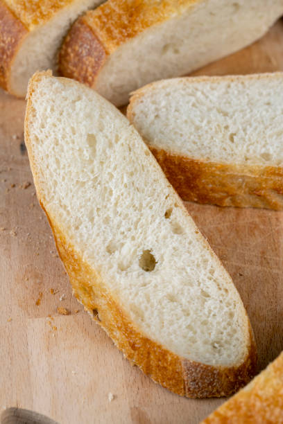 istock wheat loaf of bread close-up on the table 1802839177
