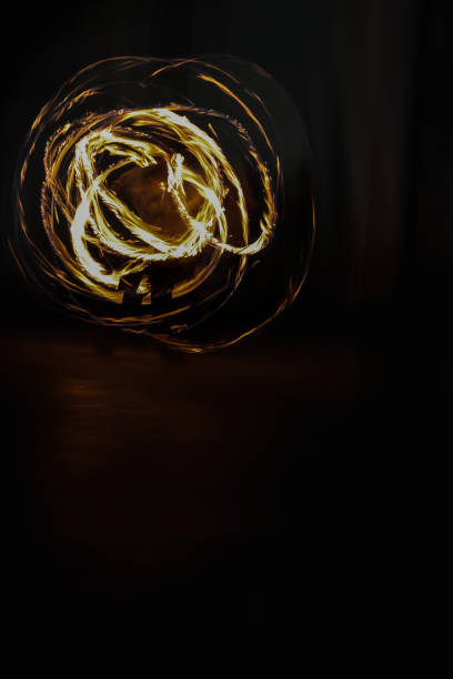 istock fire spinning in a black background like burning sun 1802844617