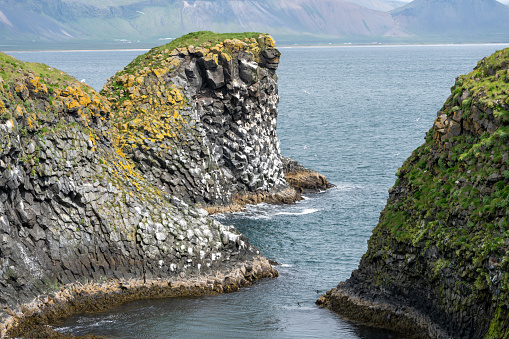 Basalt cliffs along the rugged shoreline of Arnarstapi Iceland