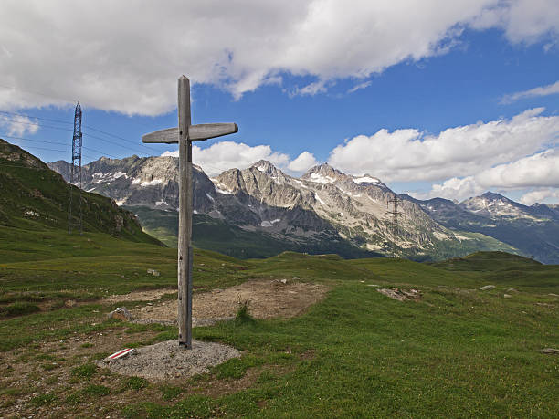 istock Wood cross in an alpine landscape (Passo San Giacomo) 180285519