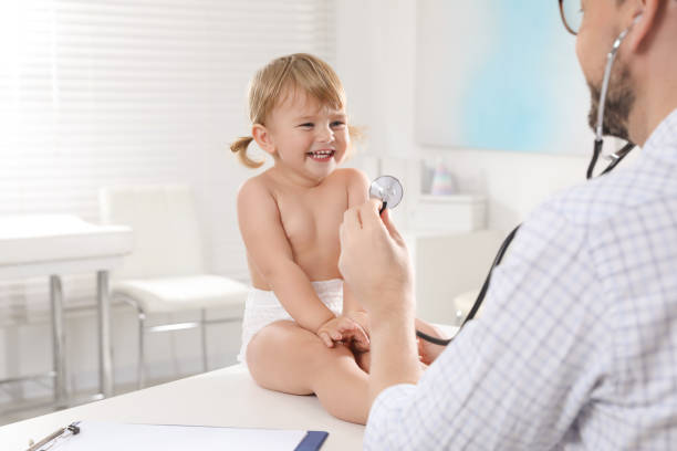 istock Pediatrician examining baby with stethoscope in clinic 1802858921