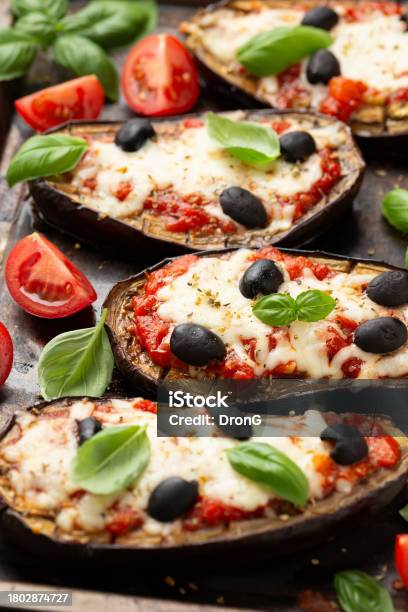 Healthy Eggplant Or Aubergine Pizza With Tomato Sauce Mozzarella Cheese Basil And Olives Stock Photo - Download Image Now