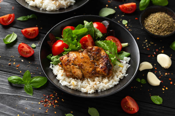 istock Baked balsamic chicken thighs with rice and vegetables 1802874756