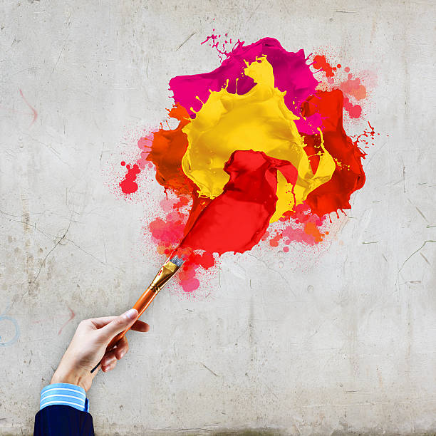 istock Human hand holding paint brush 180288961