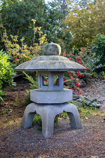 Stone lantern in the autumn sunlight at the Everett WA Arboretum