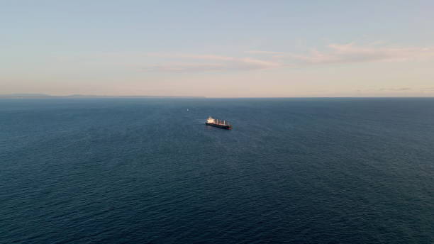 istock Barge carrier floating ocean surface drone view. Container tanker moving in sea 1802906737