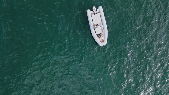 Drone view speedboat floating water surface. Sailing catamaran cruising deep sea