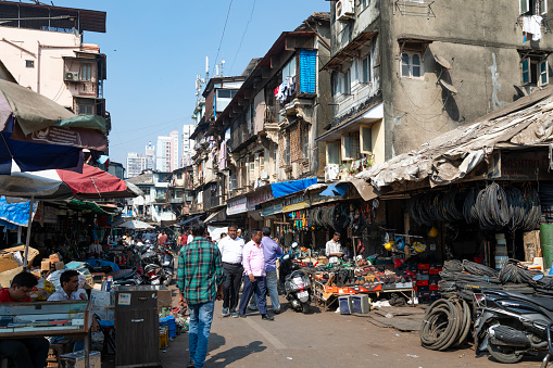 21st January, 2020 - Mumbai, India: This editorial image offers a vivid glimpse into the bustling Chor Bazar, one of Mumbai's oldest and most famous markets. Known as 'Thieves Market', Chor Bazar has a rich history and is a treasure trove of antiques, vintage items, and eclectic goods. The photograph captures the vibrant energy of the market, featuring traders, locals, and shoppers immersed in the lively atmosphere. Traders are seen displaying an array of items, from intricately designed artifacts to second-hand goods, while shoppers navigate through the narrow lanes, exploring and haggling. The image aims to reflect the market’s chaotic charm and its role as a cultural and commercial melting pot in the heart of Mumbai.