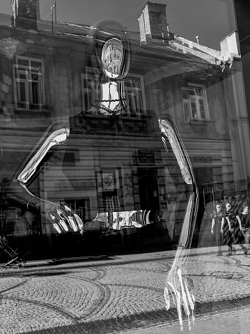 Black and white photography of the mannequin in the window of the city of the city of Przemysl Poland