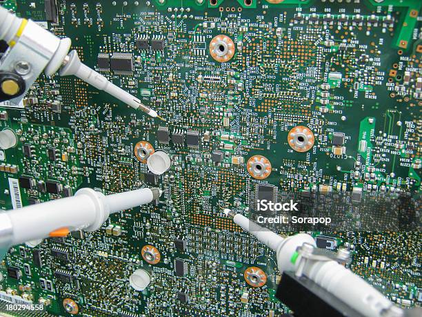 Multimeter Probes Examining A Circuit Board Stock Photo - Download Image Now - Arranging, Black Color, Chalkboard - Visual Aid