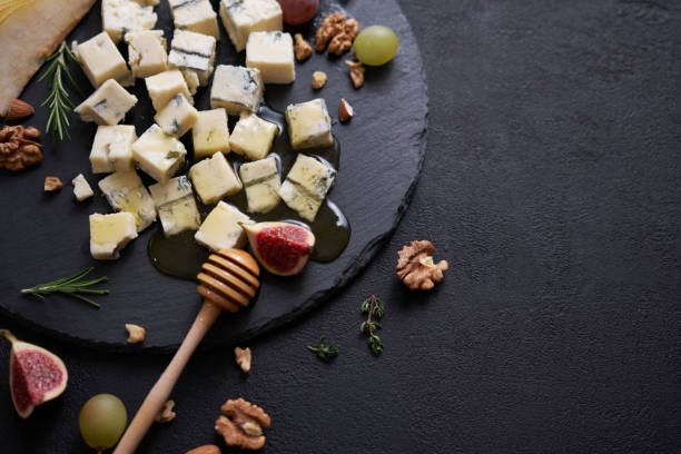 istock Sliced Traditional Italian Gorgonzola cheese on stone seving board 1802989607
