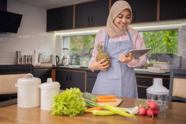 istock Young woman is preparing a meal 1802989773