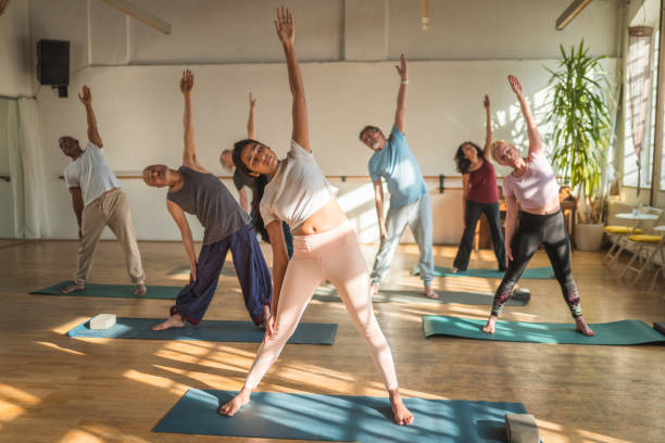 istock A Multinational Yoga Group Practicing for Good Health 1803003391