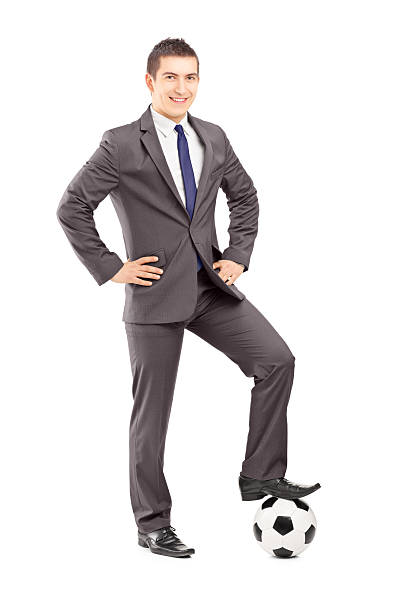 istock Young handsome businessman posing with a football 180300979