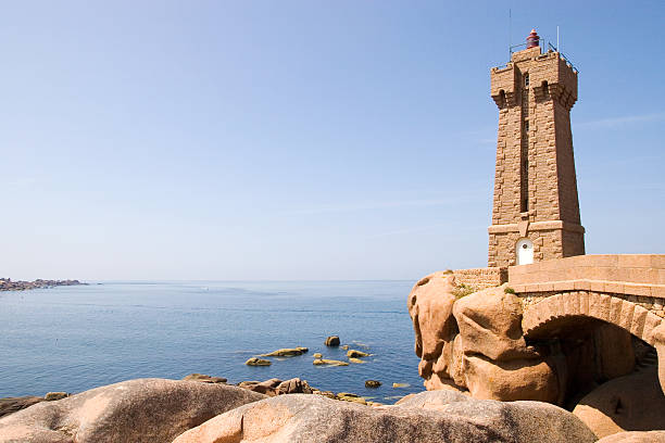 Lighthouse made from pink granite stock photo