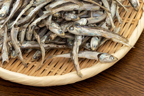 istock A pile of dried sardines on a bamboo colander 1803031941
