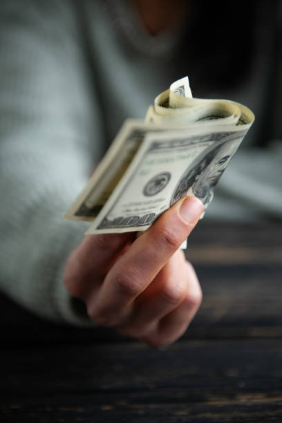 istock Hands holding dollar cash 1803040779