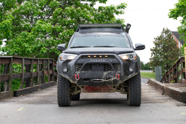 Williamsburg, Kentucky - May 27, 2023: Toyota 4Runner crossing small short wooden bridge in Williamsburg, Kentucky.