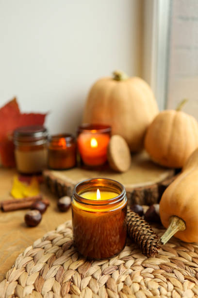 istock Burning candle and autumn decor, home decor aesthetics 1803055856