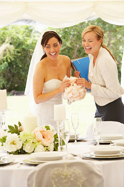 istock Bride with wedding planner at the marquee 180315592