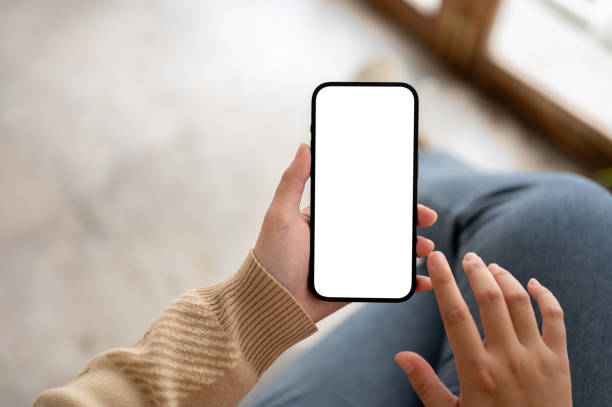 istock Close-up image of a woman using her smartphone while relaxing indoors. social media, mobile apps 1803161441