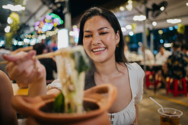 istock Smiling woman at the local restaurant 1803162547